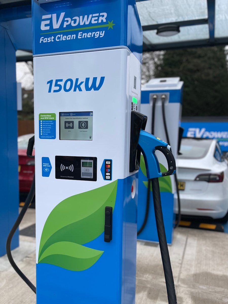 a blue and white gas pump sitting next to a white car